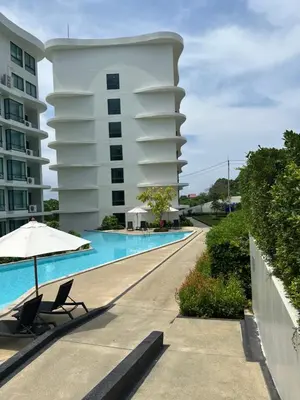 a hotel with a swimming pool next to a building at Apartment in 5 hotel with sea view and waterpark in Rawai Beach