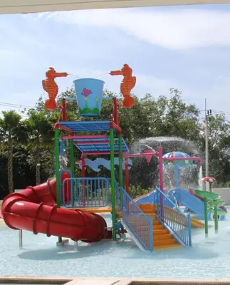 a water park with a water slide in the water at Apartment in 5 hotel with sea view and waterpark in Rawai Beach