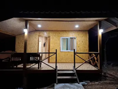 a house with a staircase leading to a window at ฟาดิลบังกะโล Fadel bungalow in Ban Lo Pa Ret
