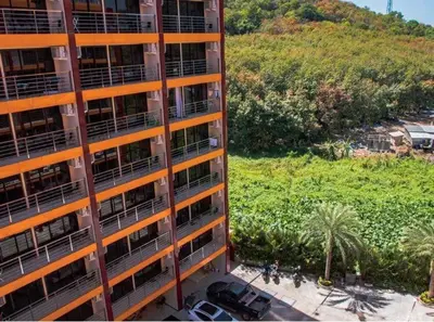 an overhead view of a tall apartment building at Nai Harn NBC 1 BR in Rawai Beach