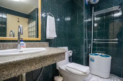 a bathroom with a toilet and a sink and a shower at 1 bed condo, No.1 location, next to Patong Beach. in Patong Beach