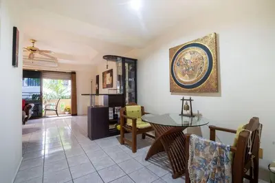 a living room with a table and chairs at 1 bed condo, No.1 location, next to Patong Beach. in Patong Beach