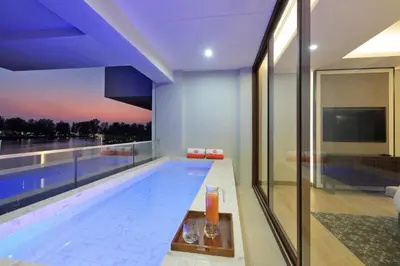 a swimming pool in a house with a view at 2bdr Lakeview Apartment Angsana oceanview residence by Capital Pro in Bang Tao Beach