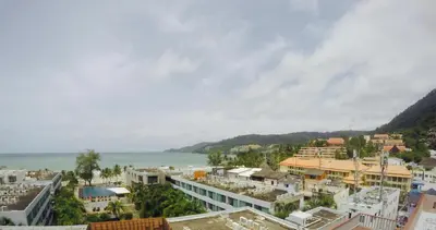 a view of a city and the ocean at 7Q Patong in Patong Beach