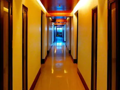 a hallway of a building with a long corridor at 7Q Patong in Patong Beach