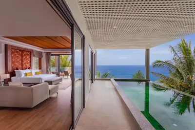 a living room with a view of the ocean at Villa La Thale in Phuket Town