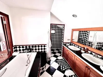 a bathroom with a black and white checkered floor at Coconut Palms Villa, Large & Elegant Private Pool Villa in Rawai, Phuket in Ban Saiyuan (1)