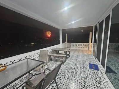 a balcony with a table and chairs and a view at Castle Villa Phuket in Kamala Beach