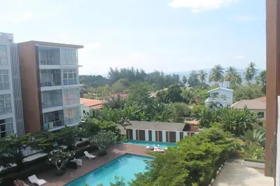 a view of the pool from the balcony of a building at Enjoy Krabi and Relax in Klong Muang Beach