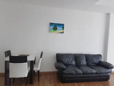 a living room with a couch and a table at Enjoy Krabi and Relax in Klong Muang Beach