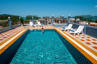 a swimming pool on the roof of a building at The Crystal Beach Hotel in Patong Beach