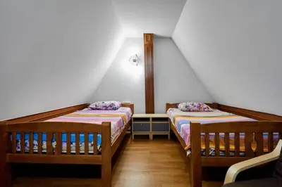 a room with two beds in a room at Bungalow Phuket in Kamala Beach