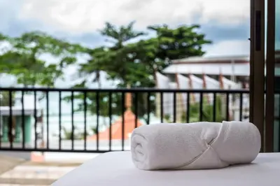 a roll of toilet paper sitting on top of a table at Two Chefs Inn in Kata Beach