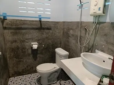 a bathroom with a toilet and a sink at Mangrove House Kohyao noi in Ban Bang Chak