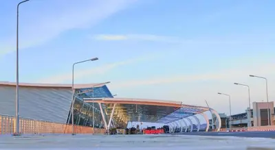 a large soccer stadium with a large building at Kim Lung Airport Hotel in Phuket