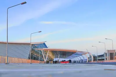a soccer stadium with a building and street lights at Kim Lung Airport Hotel in Phuket