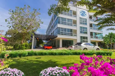 a building with a car parked in front of it at The Pano Hotel And Residence in Ao Nang Beach