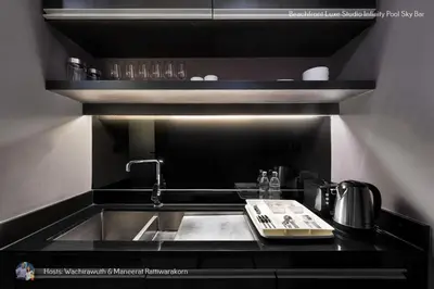 a kitchen with a sink and a counter top at Beachfront Deluxe Infinity Pool in Patong Beach