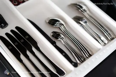 four utensils in a white tray with forks and spoons at Beachfront Deluxe Infinity Pool in Patong Beach
