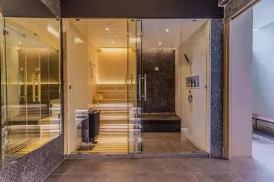 a glass door leading into a dressing room at Villa Boonta in Phuket Town