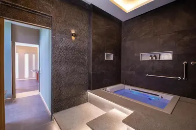 a bathroom with a jacuzzi tub in a room at Villa Boonta in Phuket Town