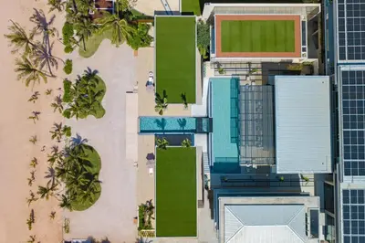 an overhead view of a building with a pool at Villa Boonta in Phuket Town