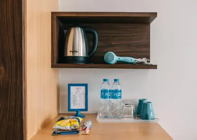 a wooden shelf with two bottles of water on it at iCheck inn Central Patong in Patong Beach