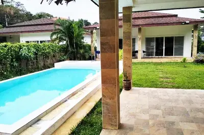 a swimming pool in front of a house at 2 Bedrooms Pool Villa in Kamala in Kamala Beach