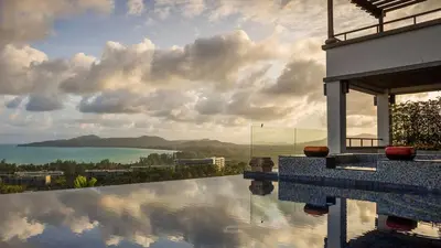 a swimming pool with a view of the ocean at Seaview Villa Yang Som at Surin Beach in Thalang