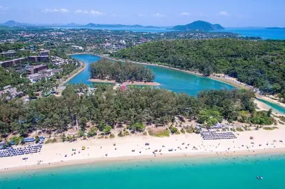 an aerial view of a beach with people on it at Nai Harn spacious studio great amenities in Rawai Beach