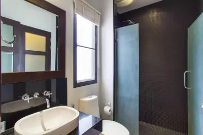 a bathroom with a sink and a toilet and a shower at Stylish 3BR Pool Villa Onyx H4, Gated Residence, Near Rawai & Naiharn Beach in Rawai Beach