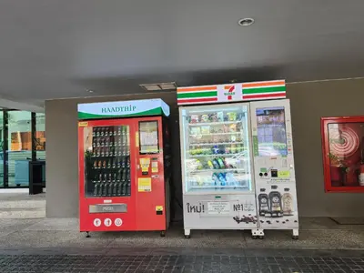 two soda machines are parked next to each other at cen 1 bed room 848 in Ban Rangeng