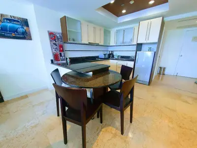 a kitchen with a dining room table and chairs at Large Apartment In Lovely Panwa - All Welcome! in Ban Ao Makham