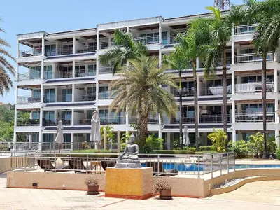 a large apartment building with a statue in front of it at Large Apartment In Lovely Panwa - All Welcome! in Ban Ao Makham