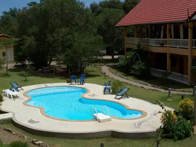 an overhead view of a swimming pool in front of a house at Sabai Residence in Ao Nang Beach