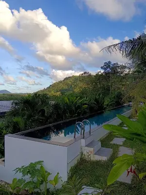 a swimming pool in the middle of a resort at Sky Lofts Phuket 2 in Thalang