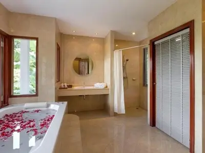 a large bathroom with a tub and a sink at Patonghill estate 6 bedroom sea view in Patong Beach