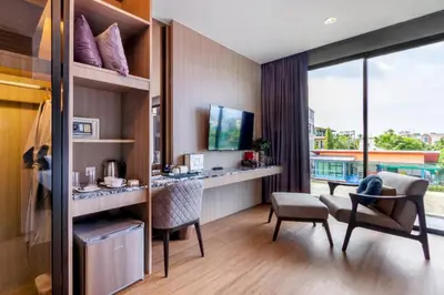 a room with a desk and chairs and a balcony at Luxury 2 Bedroom Private Pool Villa in Kamala Walk to Beach Shops and Dining in Kamala Beach