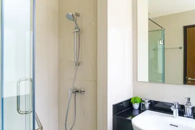 a bathroom with a shower and a sink at Lovely Townhouse in Laguna Park in Thalang