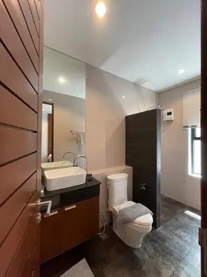 a bathroom with a toilet and a sink at John’s pool villa Rawai in Ban Saiyuan (1)