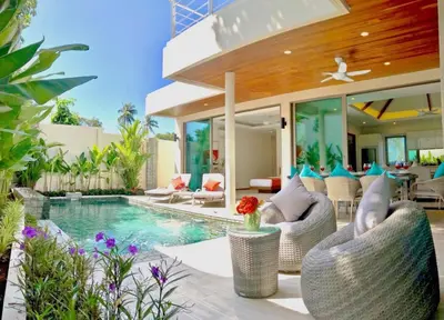 a villa with a swimming pool and a house at Beautiful Pool Villa near Rawai Beach in Rawai Beach