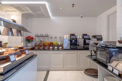 a kitchen with a counter with aasteryasteryasteryasteryasteryasteryasteryasteryastery at Chateau Du Village Patong in Patong Beach
