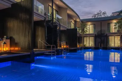 a swimming pool with blue lighting in a hotel at Luminous Resort & Spa by Areca in Phuket Town