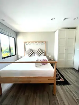 a bedroom with a large bed and a large window at A3 Руб ВАТСАП669З582I976 in Phuket Town