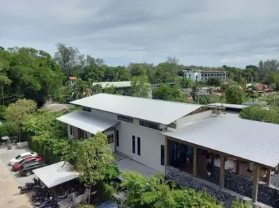 an overhead view of a white building with a parking lot at A3 Руб ВАТСАП669З582I976 in Phuket Town