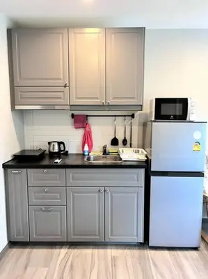 a kitchen with a white refrigerator and a sink at A3 Руб ВАТСАП669З582I976 in Phuket Town