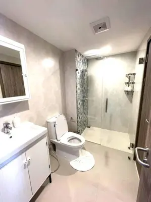 a bathroom with a toilet and a shower and a sink at B5 НОВАЯ вид БАССЕЙН ВАТСАП669З582I976 in Phuket Town