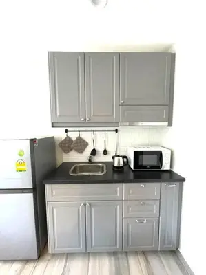 a kitchen with a sink and a microwave at B5 НОВАЯ вид БАССЕЙН ВАТСАП669З582I976 in Phuket Town