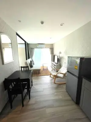 a kitchen and living room with a table and a refrigerator at B5 НОВАЯ вид БАССЕЙН ВАТСАП669З582I976 in Phuket Town