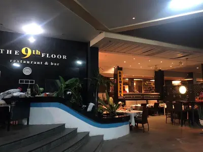 a restaurant with a pool in front of a restaurant at Cozy Patong studio apartment in Patong Beach